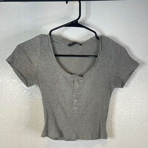 Cropped shirt with buttons down the middle.